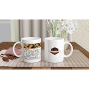 Set of two UNDENIABLE LETS GET WIRED 325ml white ceramic mugs on a dining table, featuring vintage wiring design and Vintage Wheels logo.