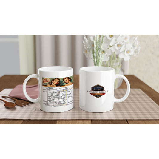 Set of two UNDENIABLE LETS GET WIRED 325ml white ceramic mugs on a dining table, featuring vintage wiring design and Vintage Wheels logo.