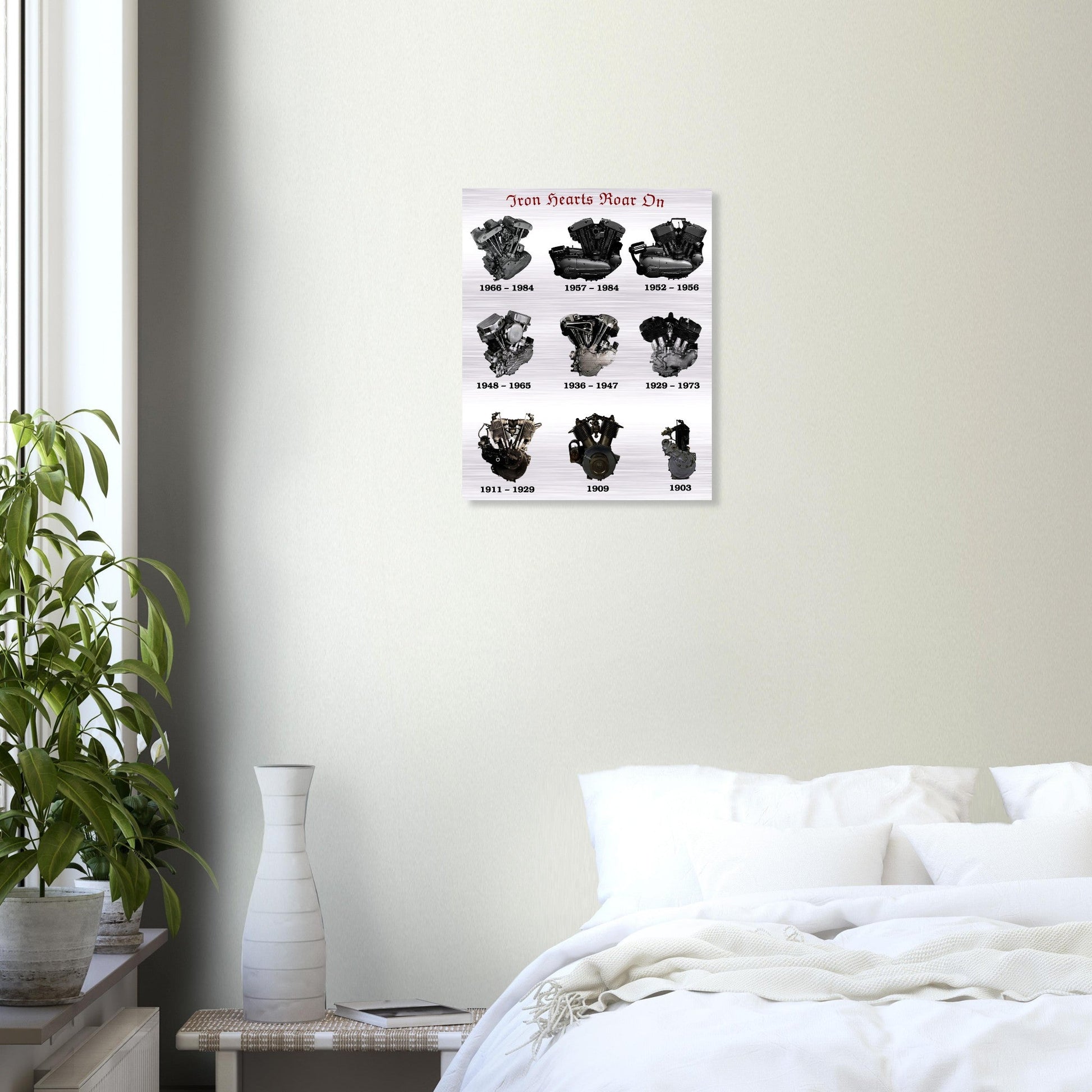 WALL ART IRON HEARTS ROAR ON BRUSHED SILVER ALUMINUM 40x50 cm hanging above a bed, adding vintage motorcycle charm to a cozy bedroom setting.