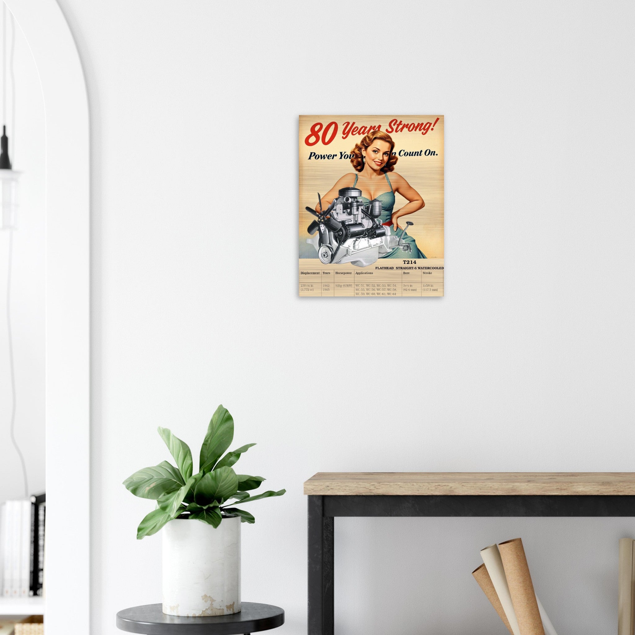 Vintage-inspired aluminum print of Flathead Straight-6 engine T214, hung on a white wall above a shelf with plants and books.